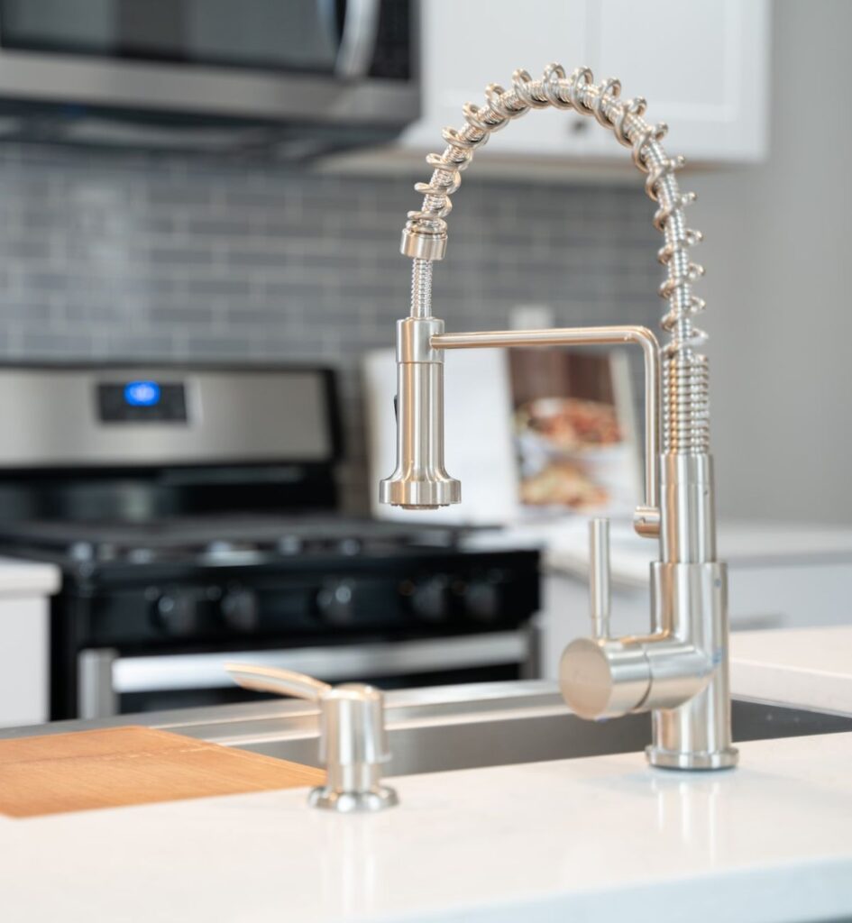 A kitchen faucet is loose from the countertop